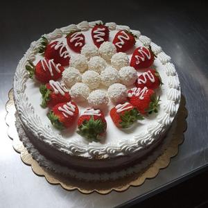 A simple and quickly made Strawberry Cake, decorated with Strawberries and Coconut Balls